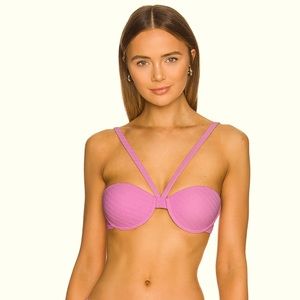 Pink halter effect bikini top by Camila Coelho.